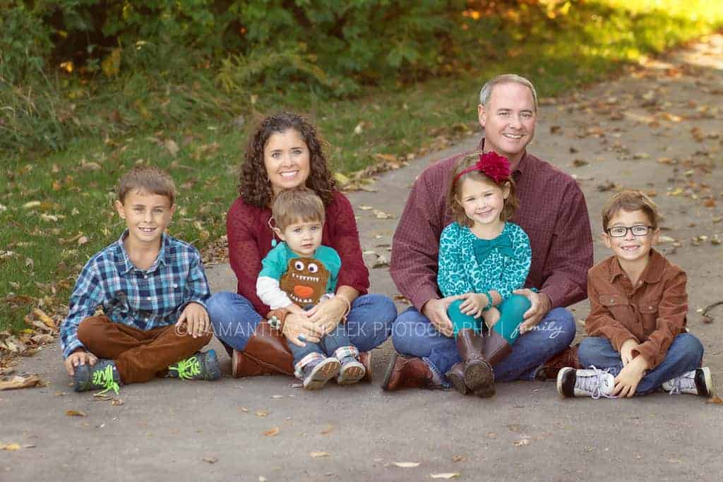 family sits on path at carter park in mason ohio