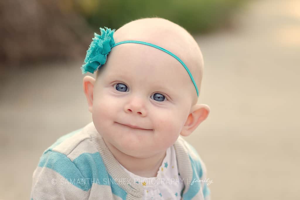 baby girl smiles at samantha sinchek