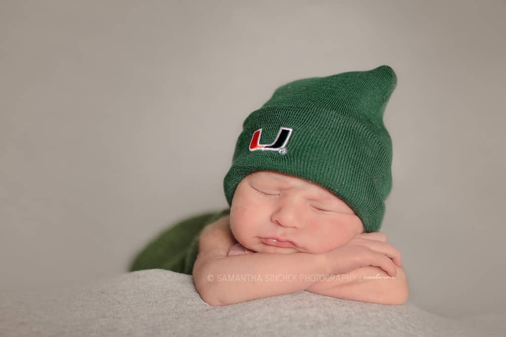 cincinnati newborn wears miami hurricanes beanie