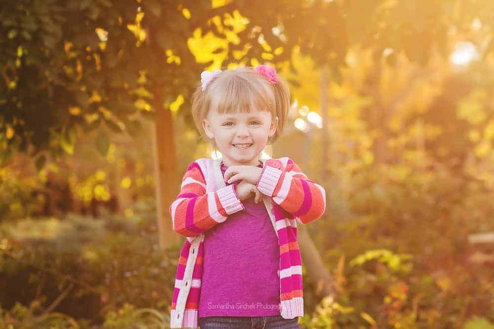 Backlit photo of a toddler girl at a family photo session with Samantha Sinchek Photography