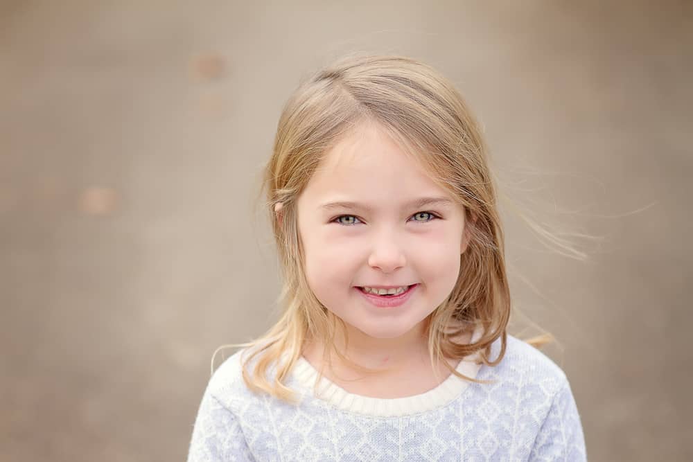 beautiful girl smiles at the camera during her Cincinnati photo session
