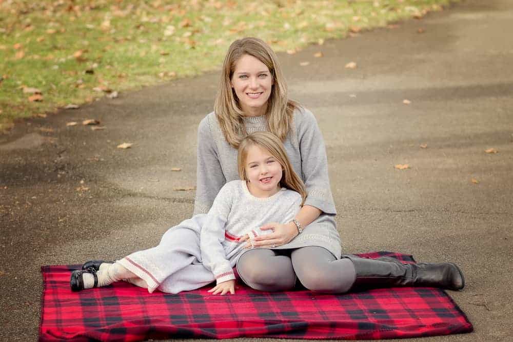 mother and daughter pose on a blanket during their family pictures with Samantha Sinchek Photography
