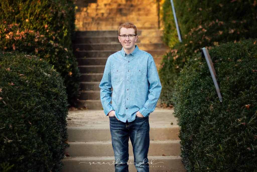 cincinnati senior stands on steps at ault park