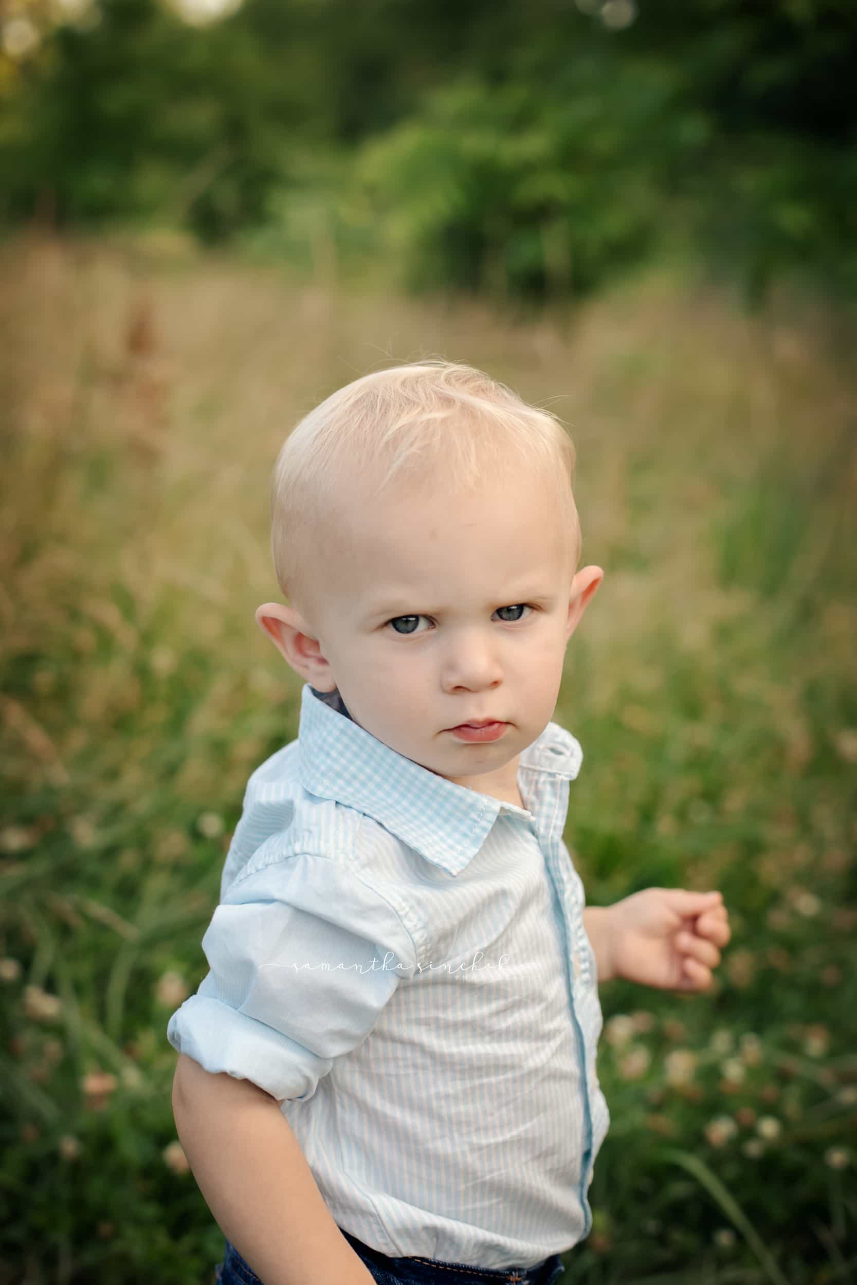 toddler smiles at camera during our cincinnati family photographer session