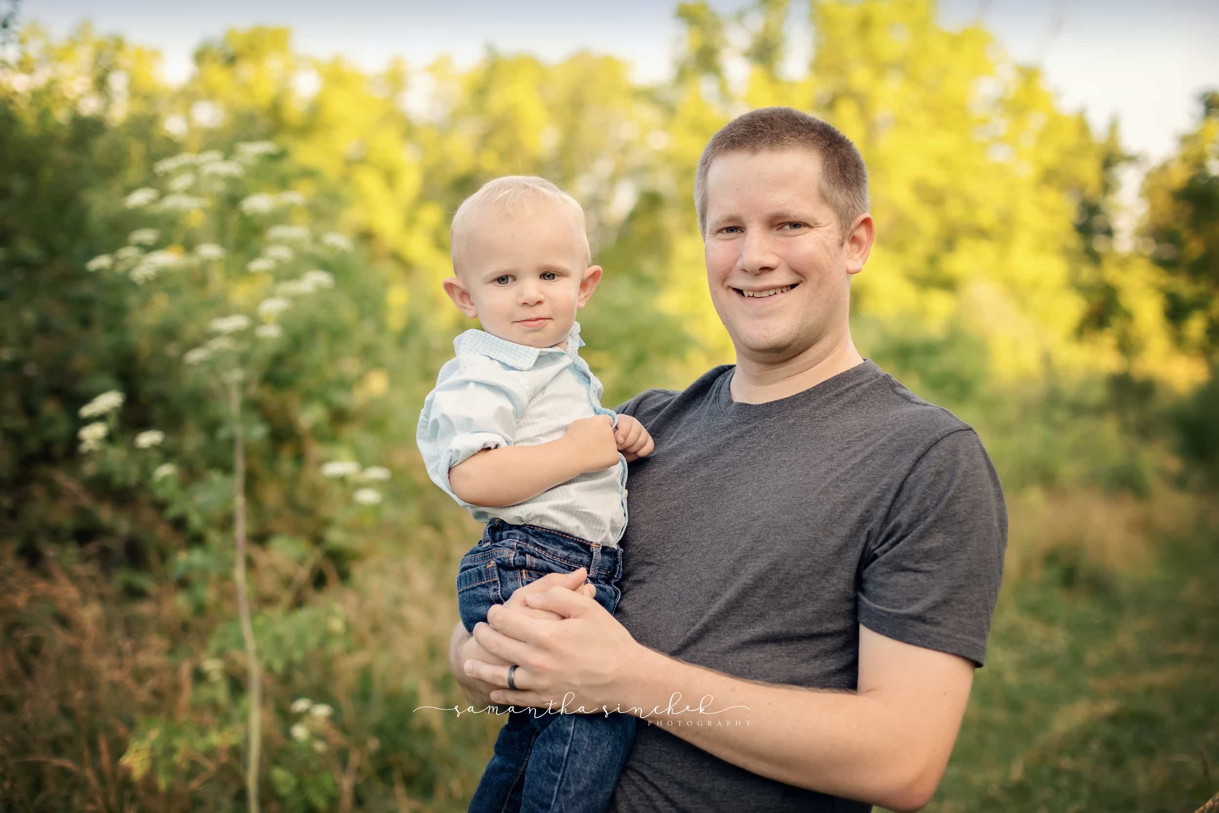 father holds baby during family pictures at sharon woods with samantha sinchek 