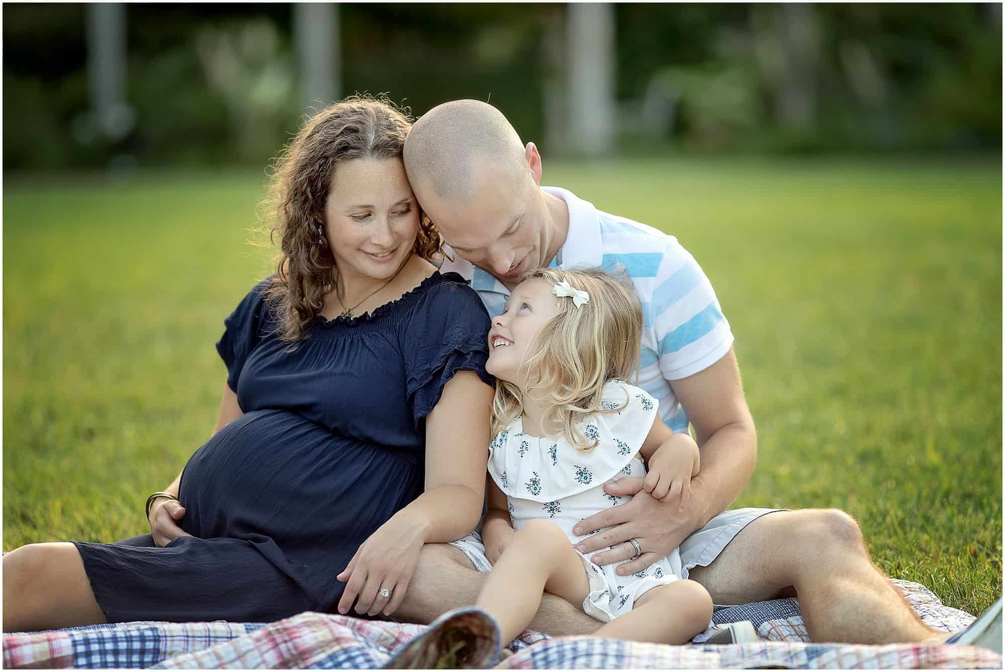family of three smile at cincinnati maternity photographer session with Samantha sinchek photography