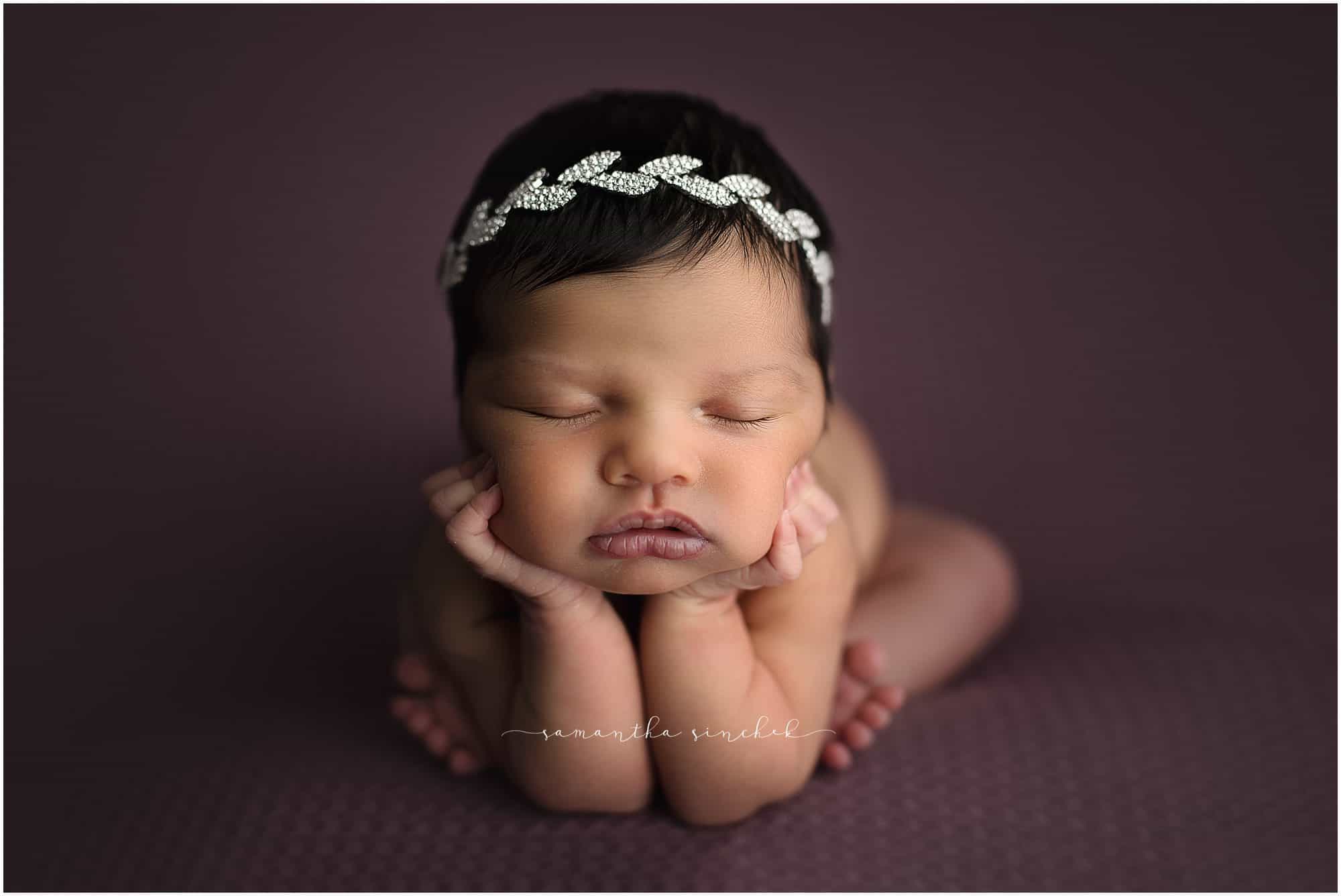 newborn girl sleeps on beautiful purple background with Samantha Sinchek photography of Cincinnati Ohio