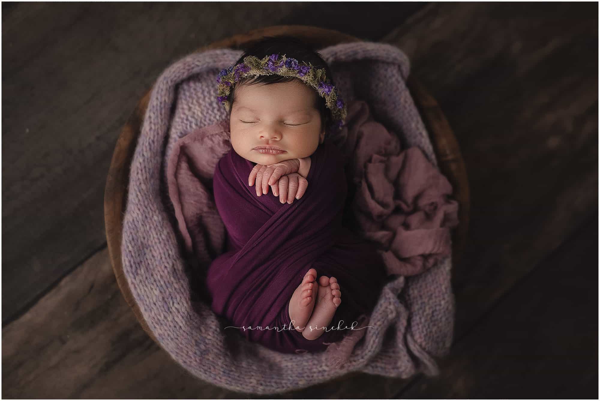 newborn girl sleeps on beautiful purple background with Samantha Sinchek photography of Cincinnati Ohio