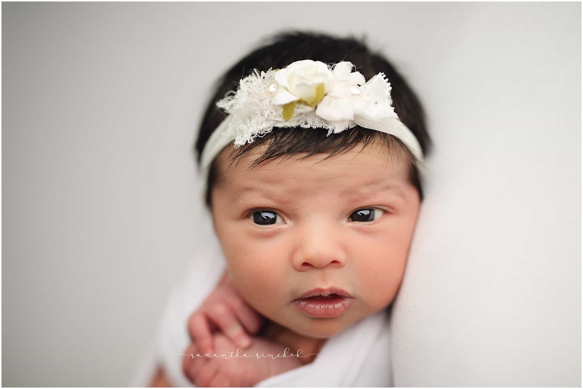 newborn girl awake at newborn pictures with Cincinnati's best newborn photographer Samantha sinchek