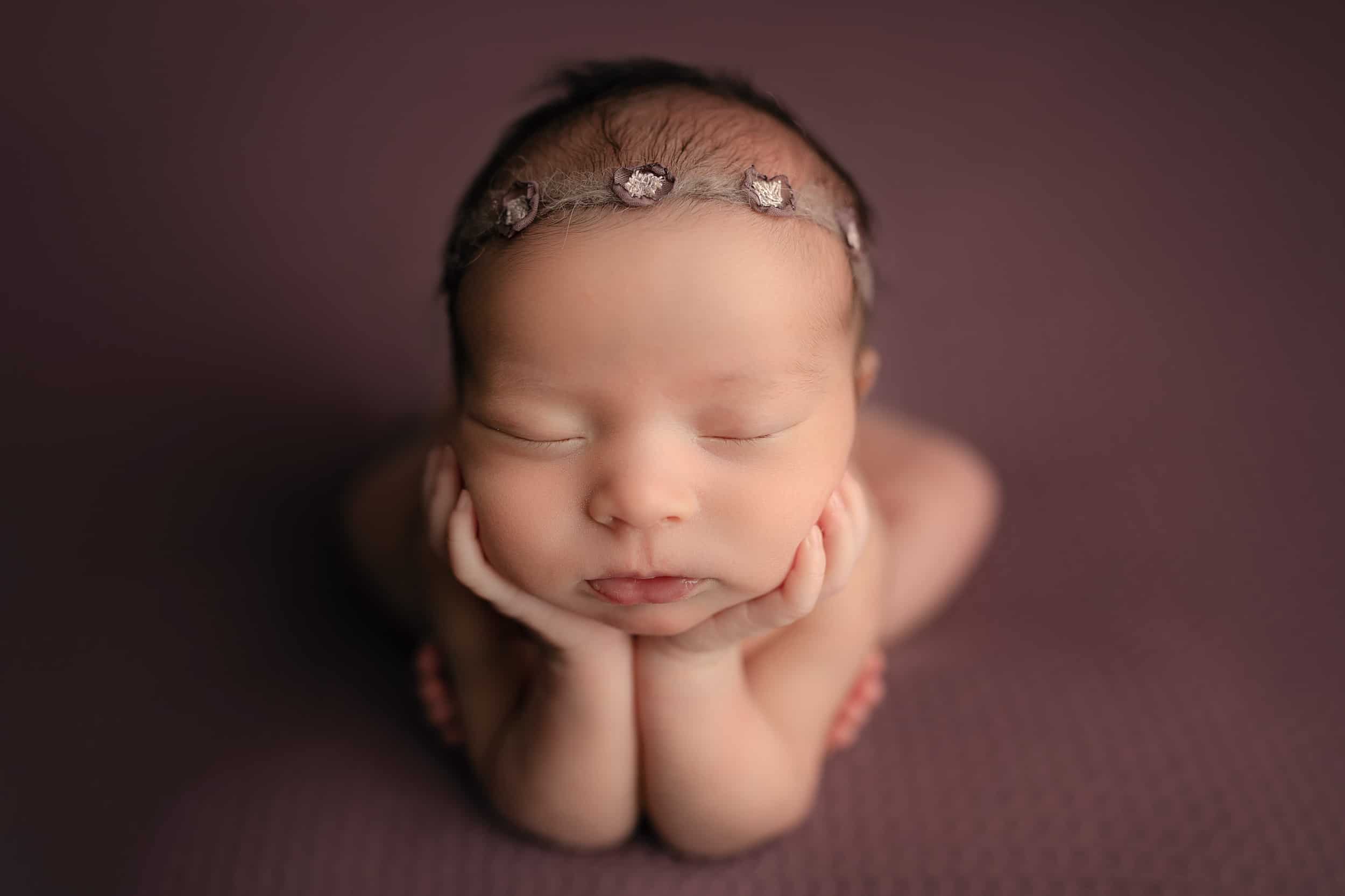 sleeping newborn on purple at cincinnati's best newborn photographer Samantha Sinchek