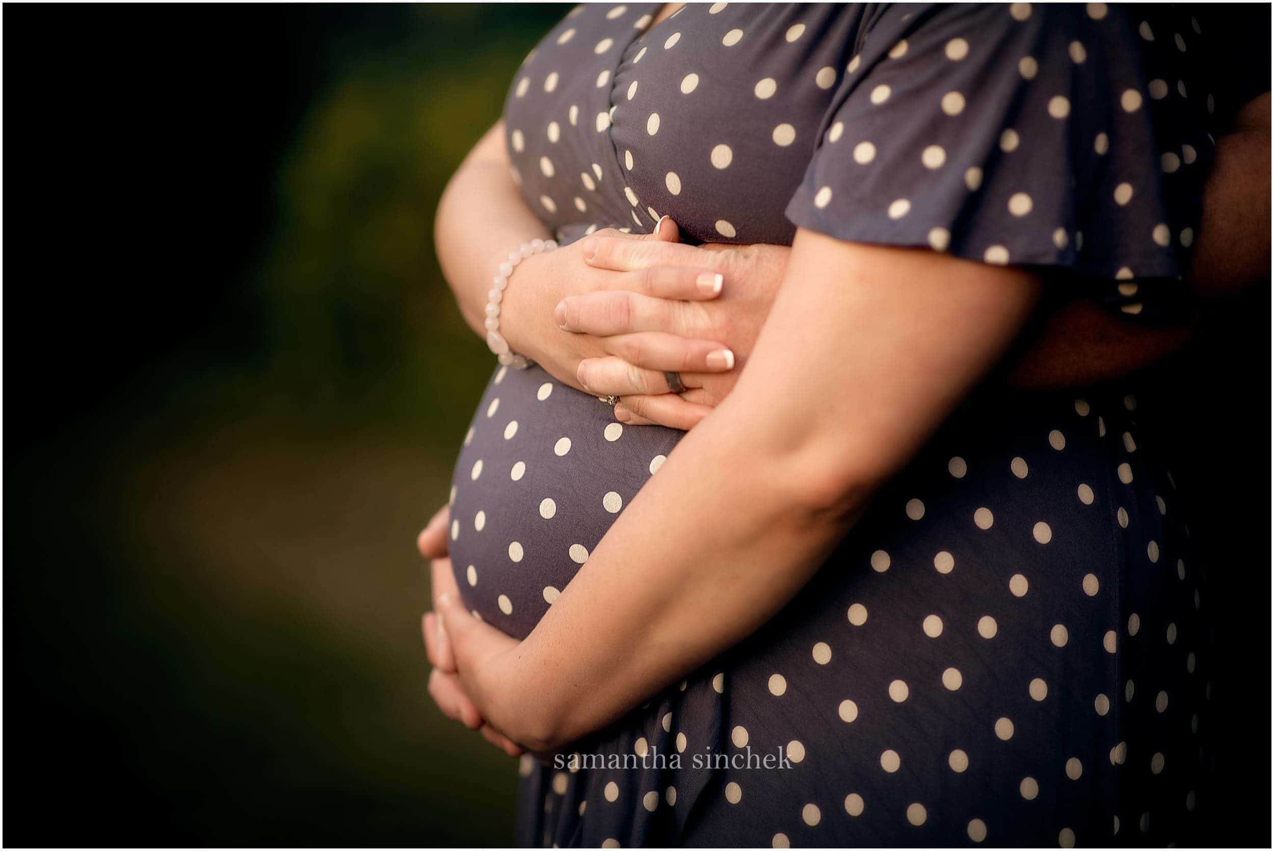 mother and father holding belly