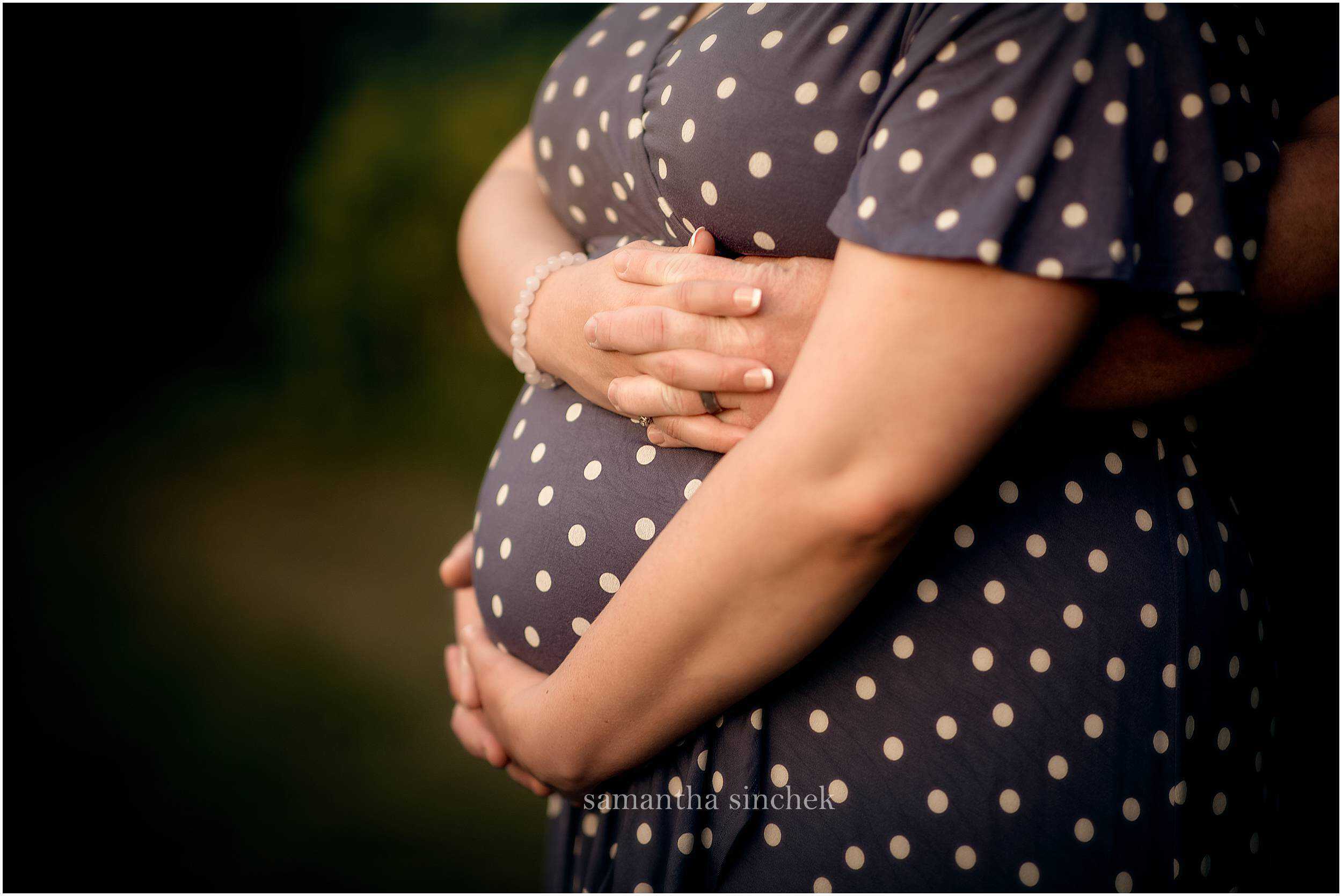 mother and father holding belly