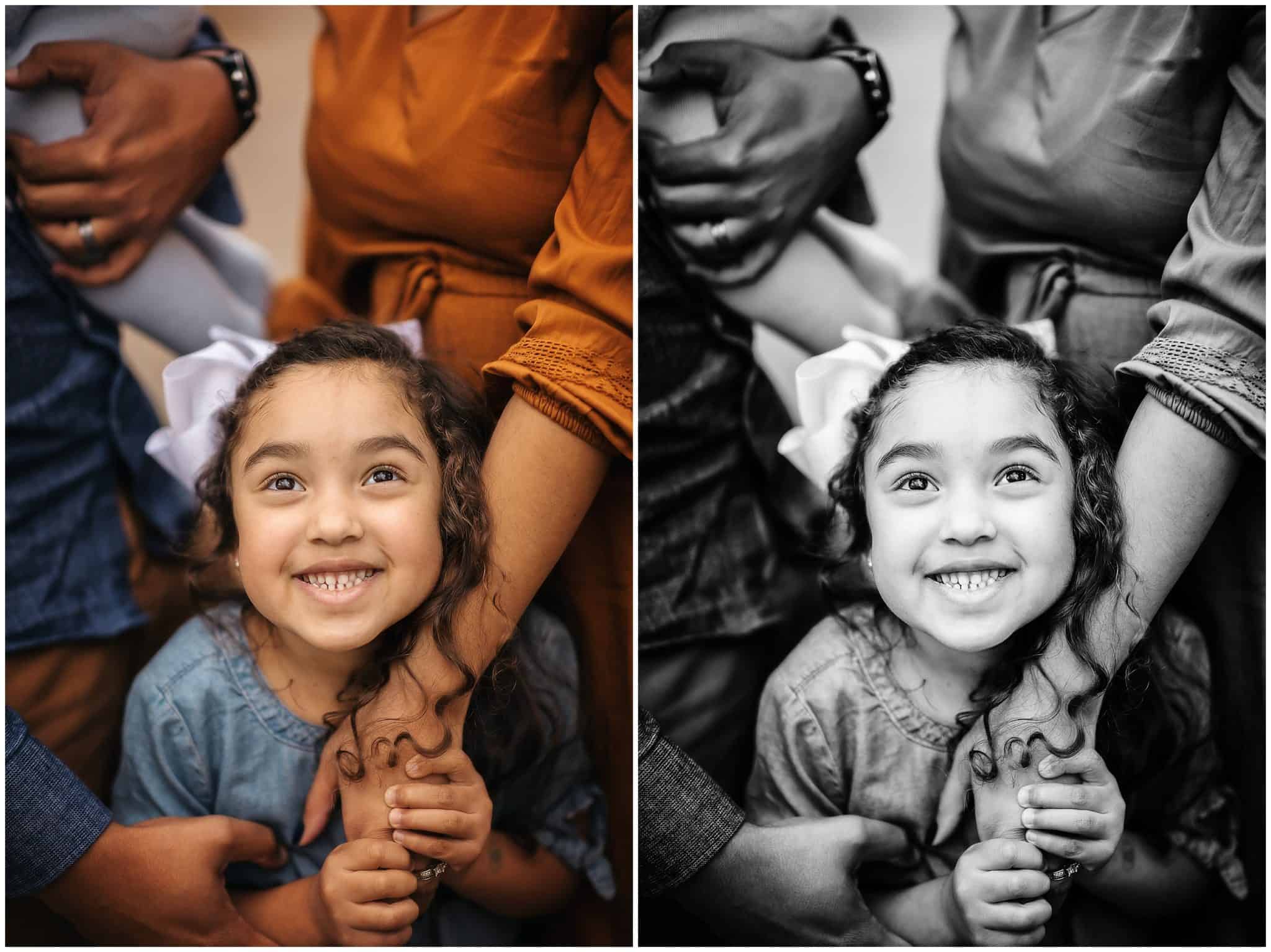 little girl smiles up at parents at family pictures with Samantha Sinchek photography