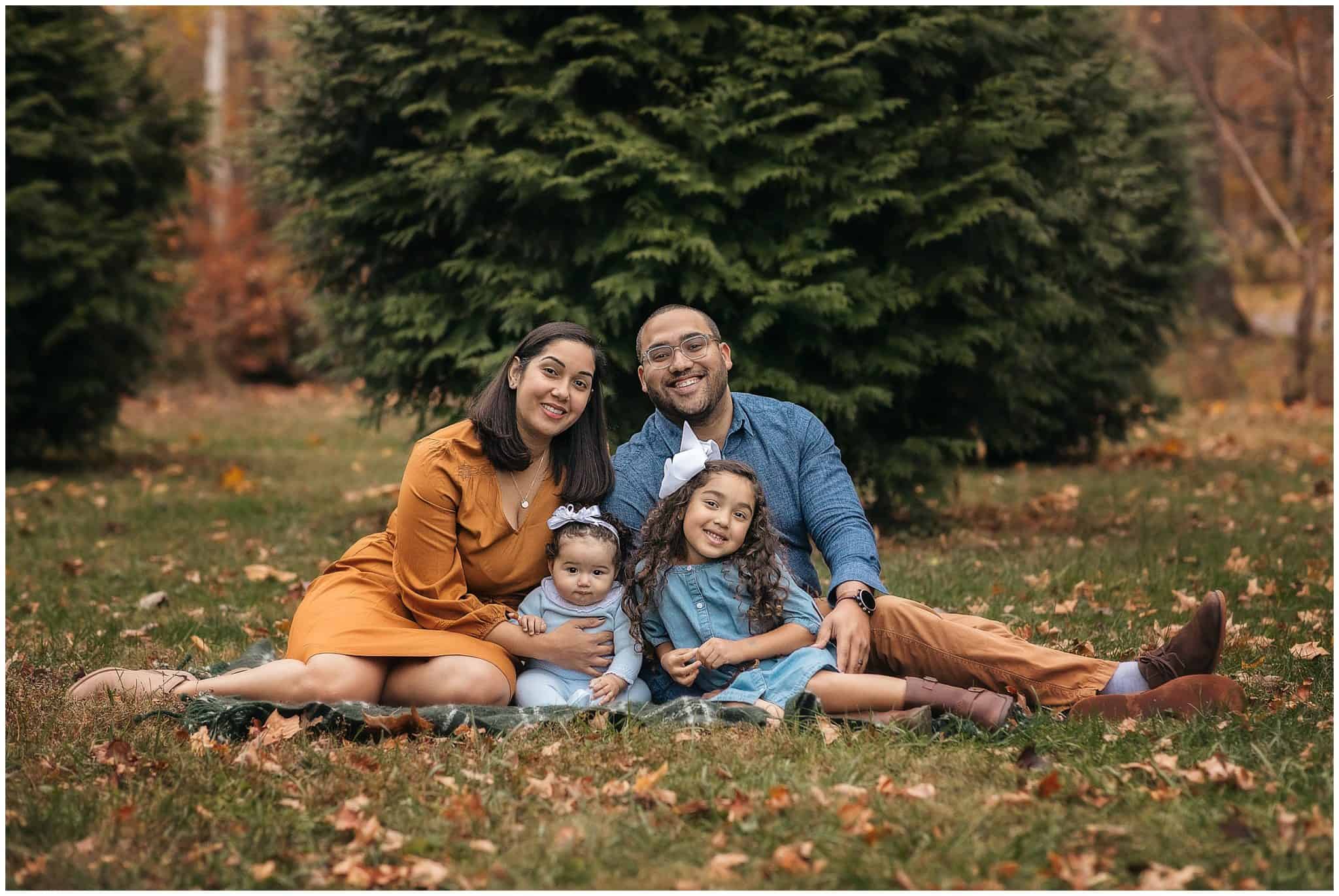 family poses at cincinnati park Sharon woods in the fall