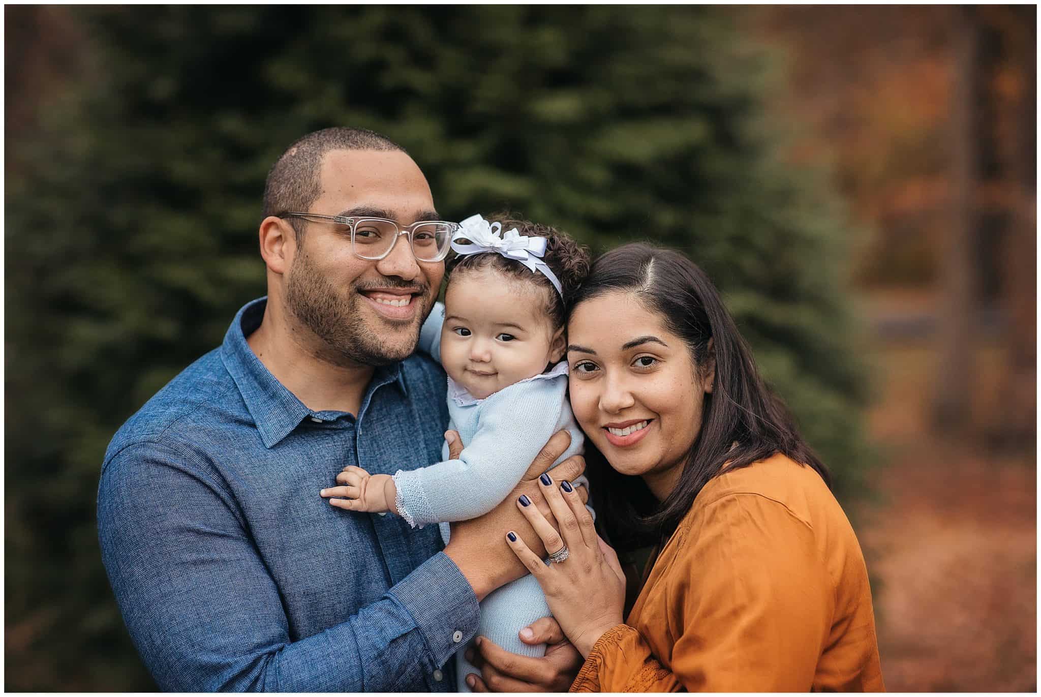 family poses at cincinnati park Sharon woods in the fall
