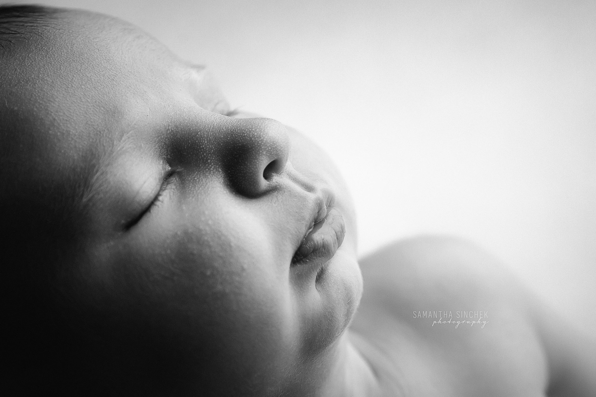 macro picture of baby face in black and white with Cincinnati's best newborn photographer