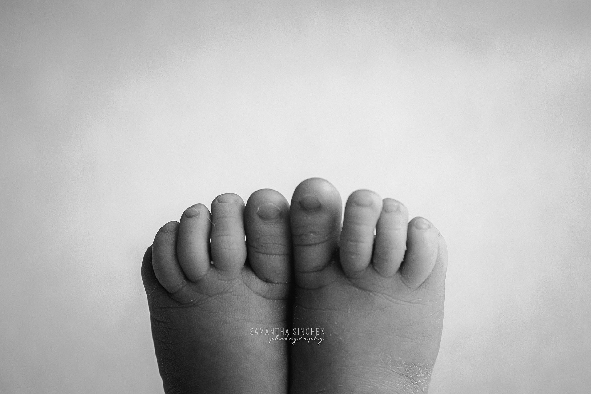 macro picture of baby face in black and white with Cincinnati's best newborn photographer