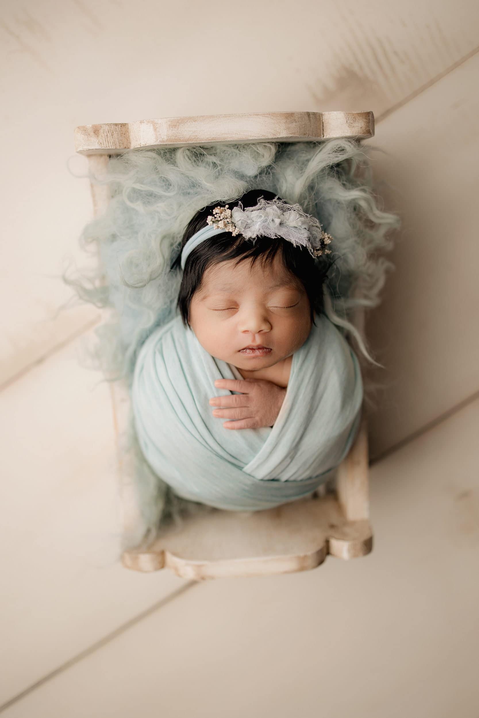 newborn sleeps bundled at cincinnati newborn photographer